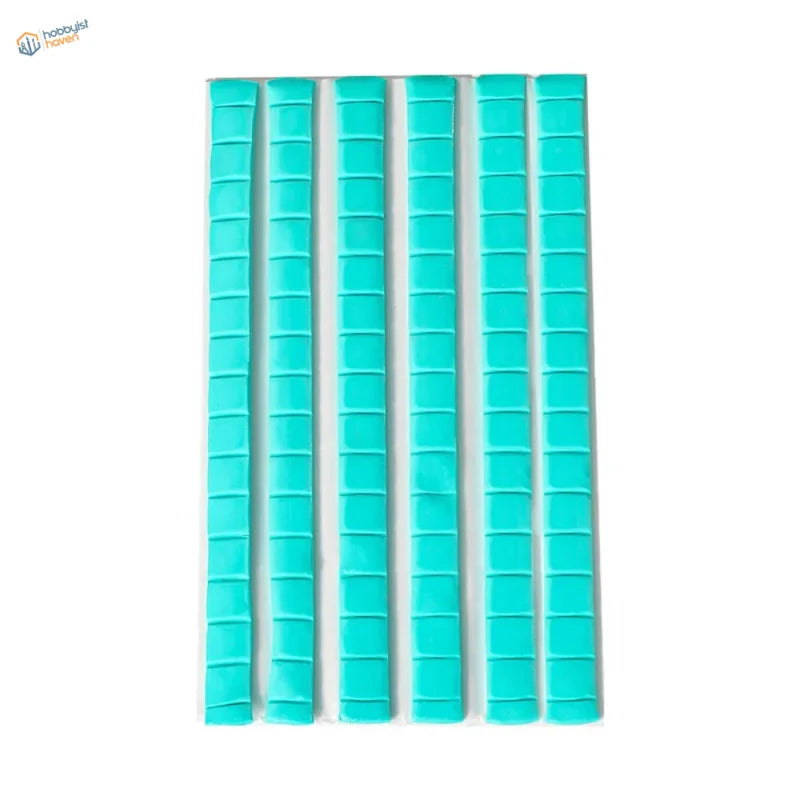 Six turquoise reusable tack strips with grid pattern for scale modeling