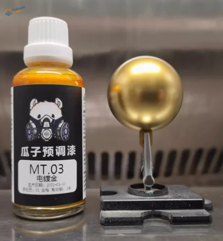 50ml bottle of gold electroplated mirror-chrome paint with metallic sample sphere