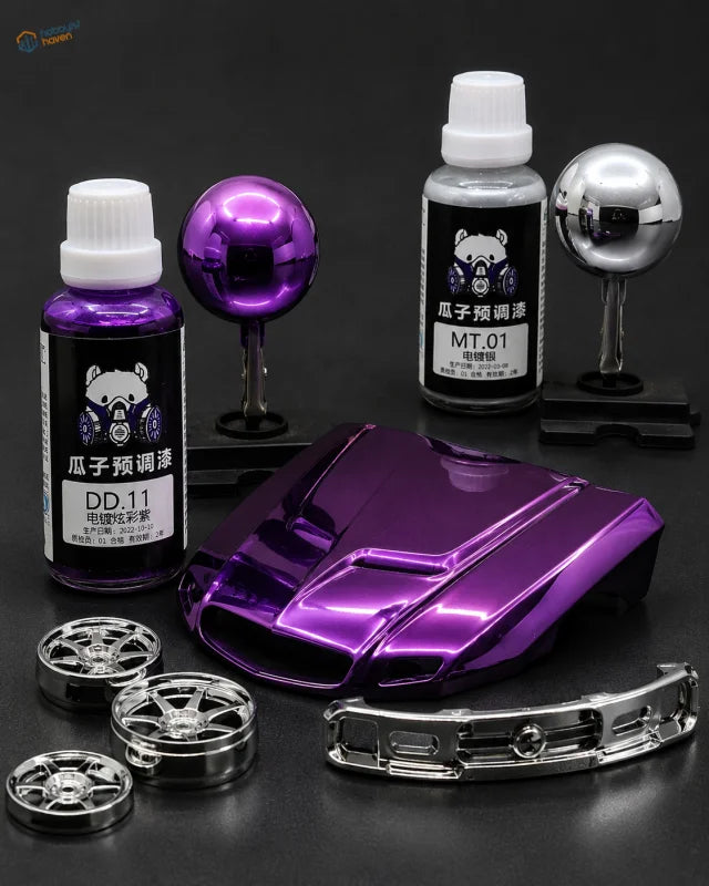 Purple metallic car body panel with glossy electroplated color paint displayed with matching paint bottles and chrome parts