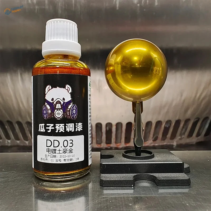 50ml copper gold electroplated paint beside a polished chrome sample sphere