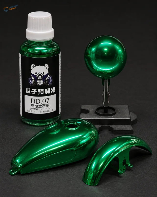 A 50ml electroplated color paint bottle in glossy metallic emerald green for modeling tools with a cartoon bear label