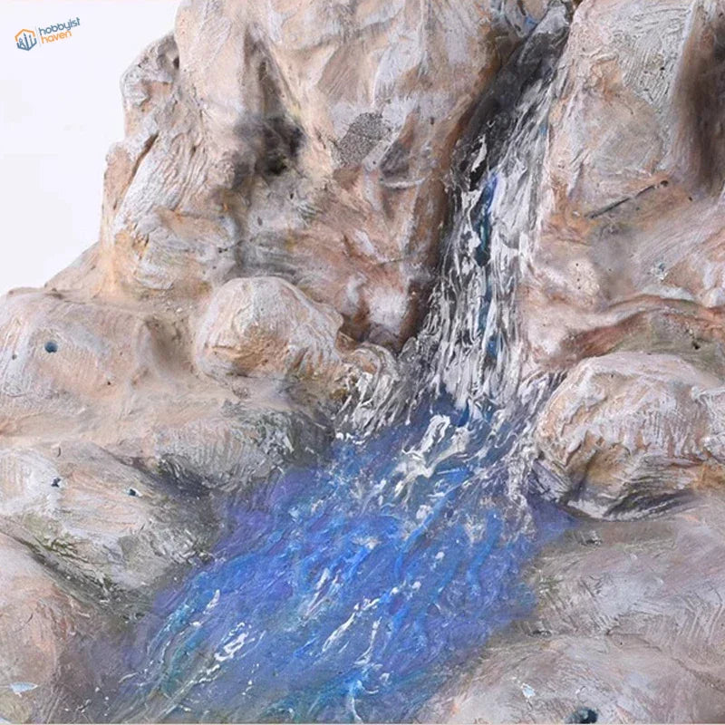 Detailed resin waterfall sculpture using 50ml water effect gel, vibrant blue flow