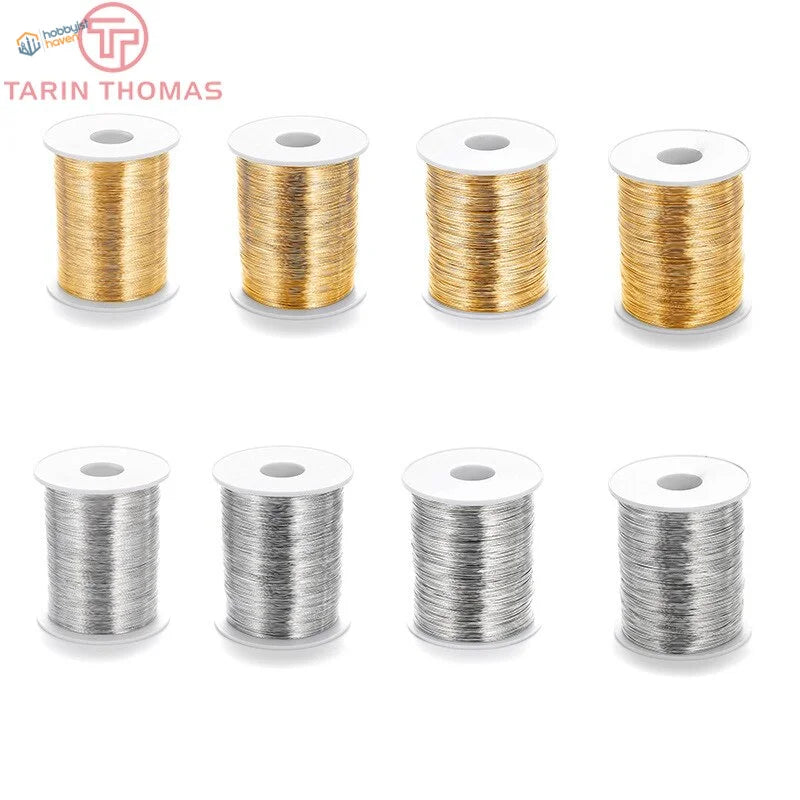 Eight 5m brass steel wire spools in gold and silver, 0.3-0.8mm