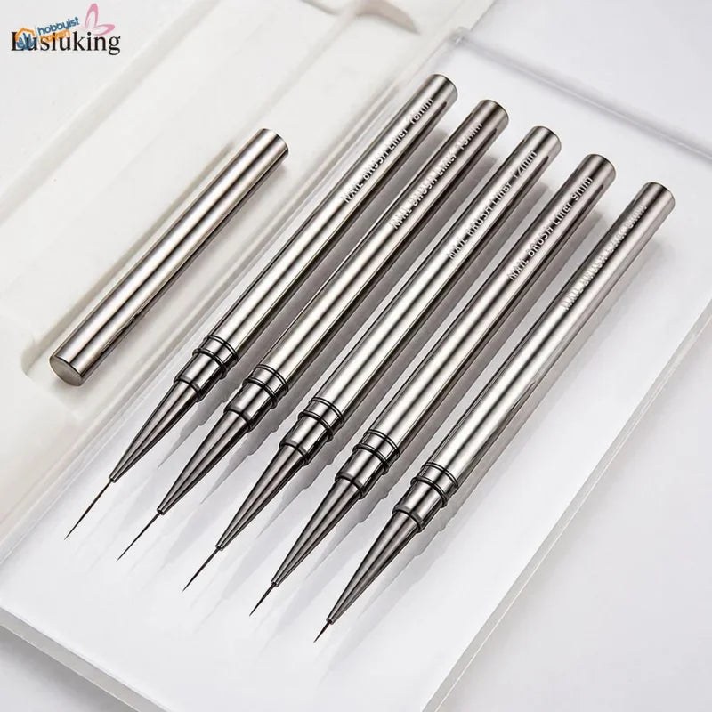 5 ultra-fine liner brushes laid out with their protective cap, showing the needle-fine bristle tips