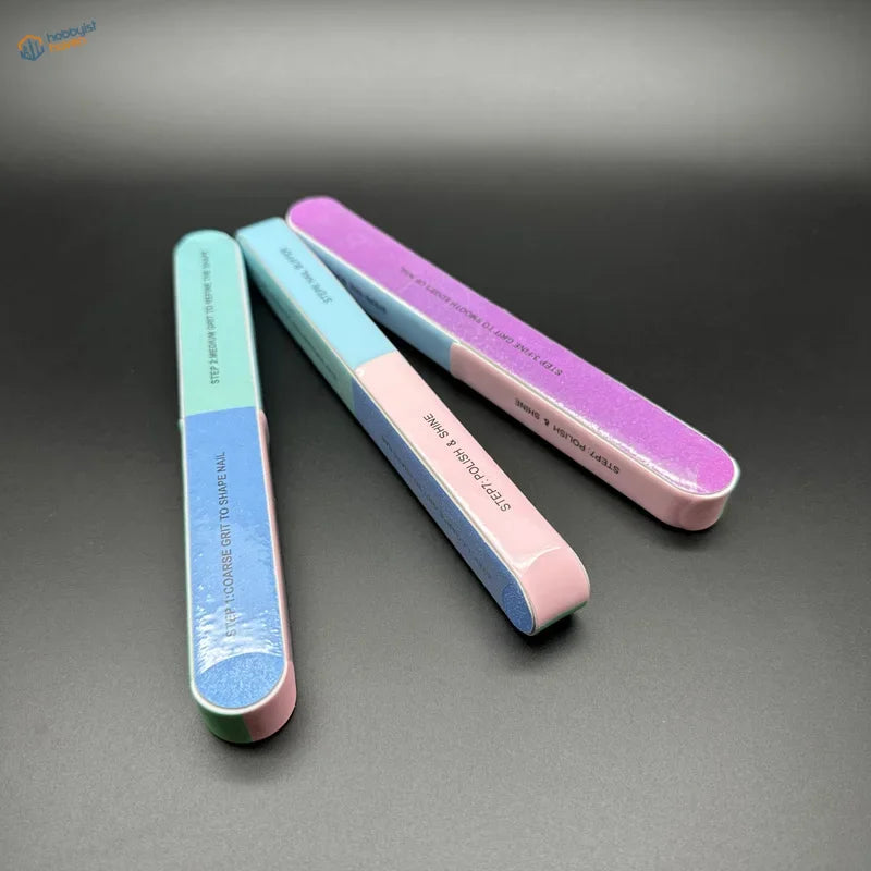 Seven-sided polishing rod with pastel multi-step abrasive surfaces designed to remove mold lines and polish models