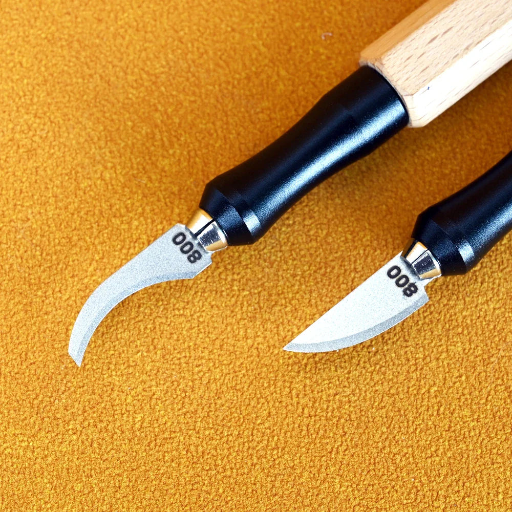 Two precision leather carving tools with black ergonomic handles and silver curved emery file blades from 100Shiki