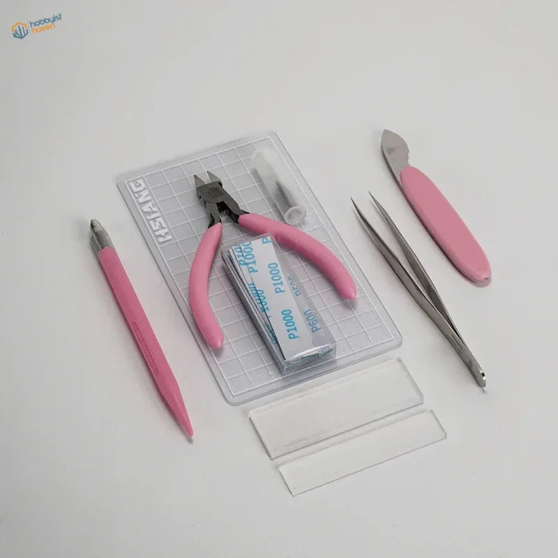 7pcs basic model building tool set with pink-handled precision hobby tools and metallic blades in clear plastic grid tray