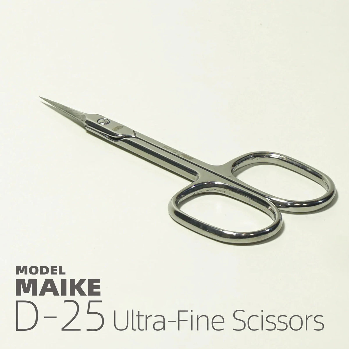 MAIKE D25 long tip scissors lying flat, shown from the side