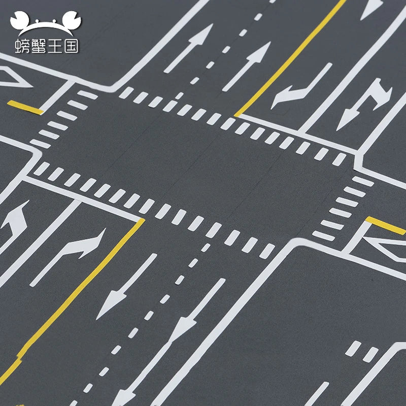 Close-up of road junction markings with arrows and zebra crossings