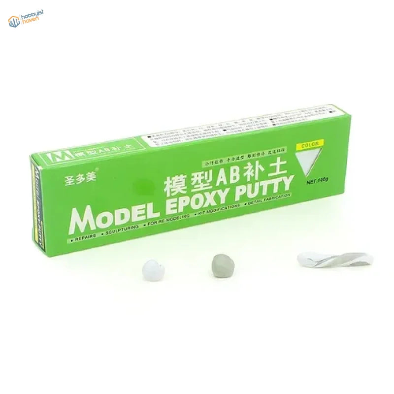 Green rectangular box of ab epoxy putty with white and gray putty samples for scale modeling tools and scale model repairs