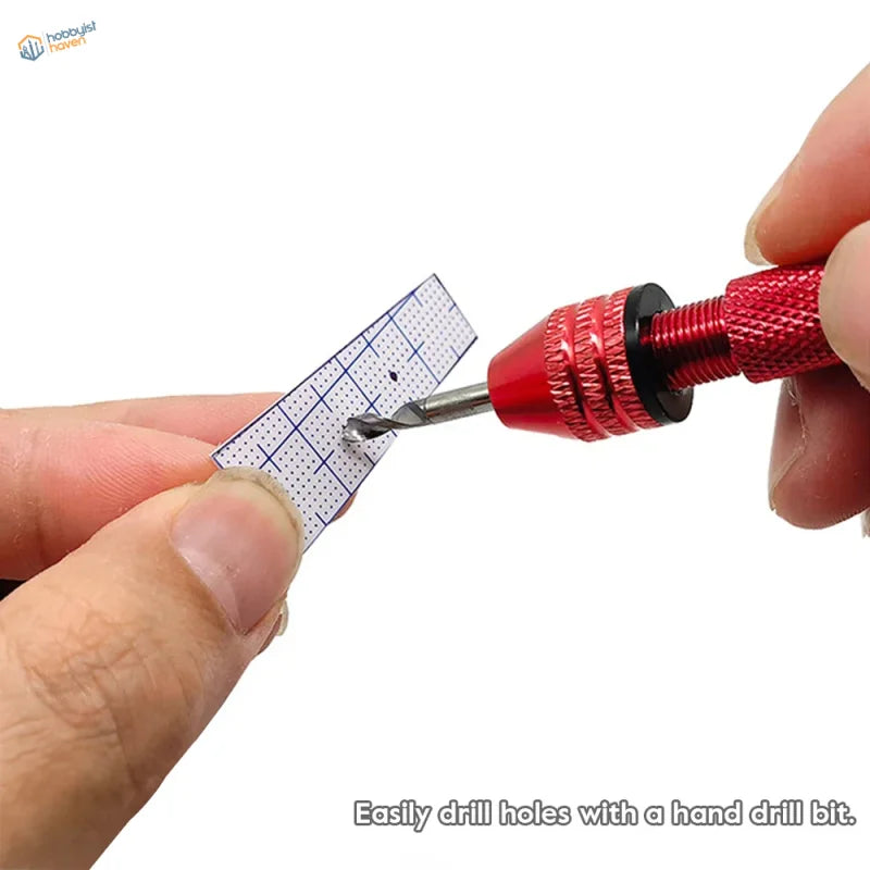 Red hand drill bit with textured grip piercing holes in abs plastic modeling sheets with grid markings