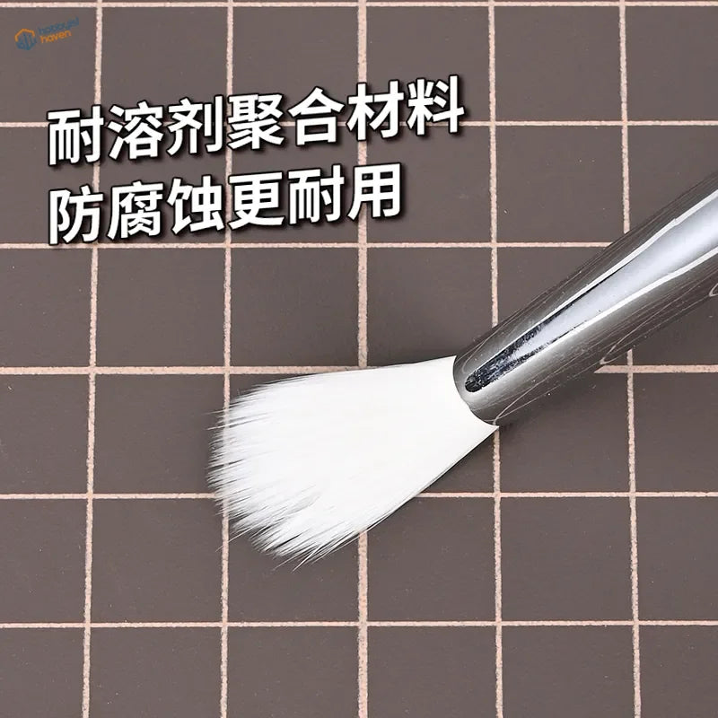 Sleek silver-handled airbrush cleaning brush with soft white bristles