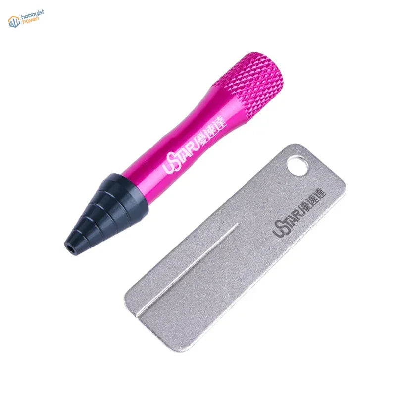 Pink and black airbrush needle repair whetstone with textured grip handle