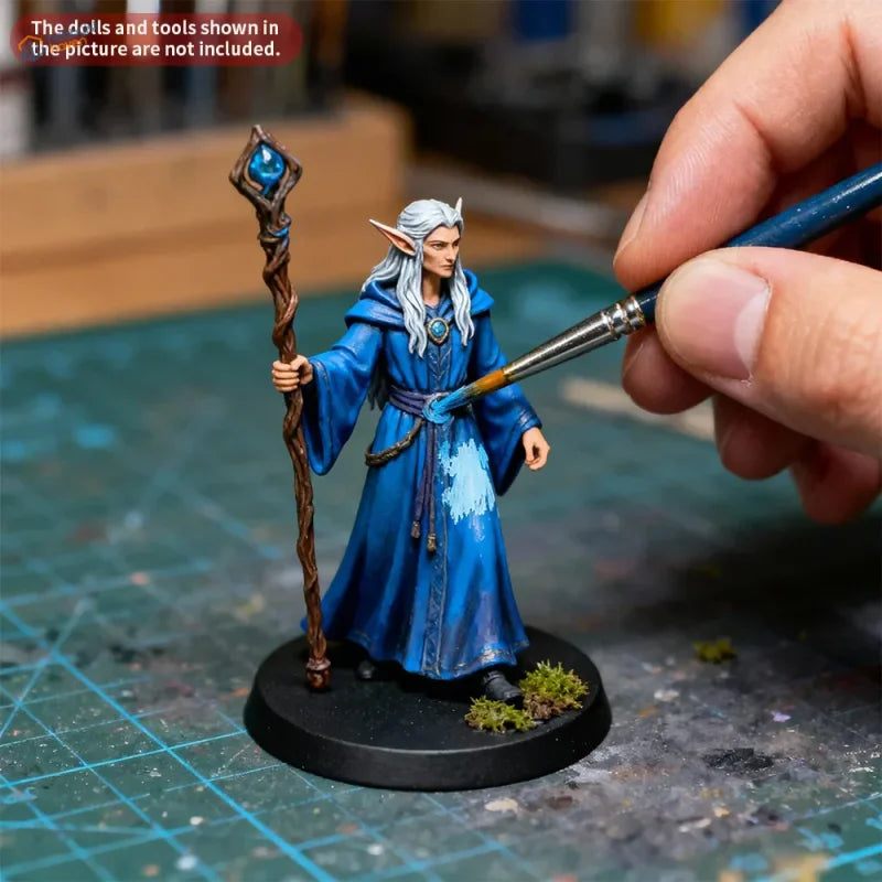 Detailed blue fantasy elf figurine on basing set with grass powder black base