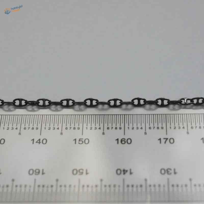 Black oxidized metal anchor chain with classic oval link design for model ships use