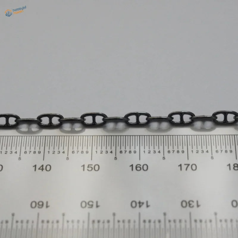 Black metal anchor chain with sleek uniform links designed for model ships as a metal anchor chain accessory