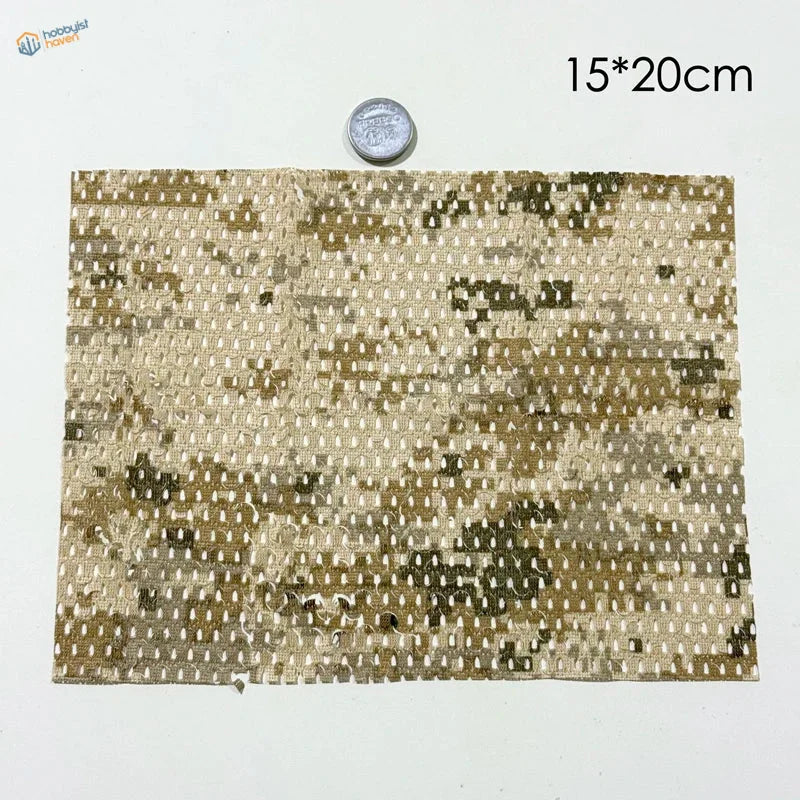 A rectangular piece of tan and olive flexible cloth camouflage netting fabric for train layouts and scale dioramas