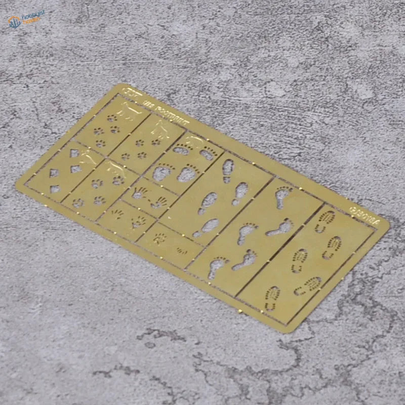 Cormake scenery effects stencils with gold tiny details foot handprint grid