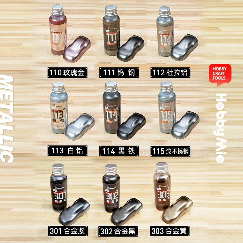 Set of six hobby mio 50ml oil-based metallic paint bottles with rose gold gunmetal and bronze swatches for model building tools