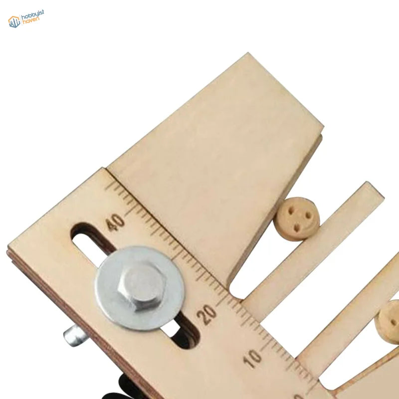 Detail of Deadeyes assembly tool: metal knob in the sliding slot, engraved scale and a 3-hole wooden deadeye
