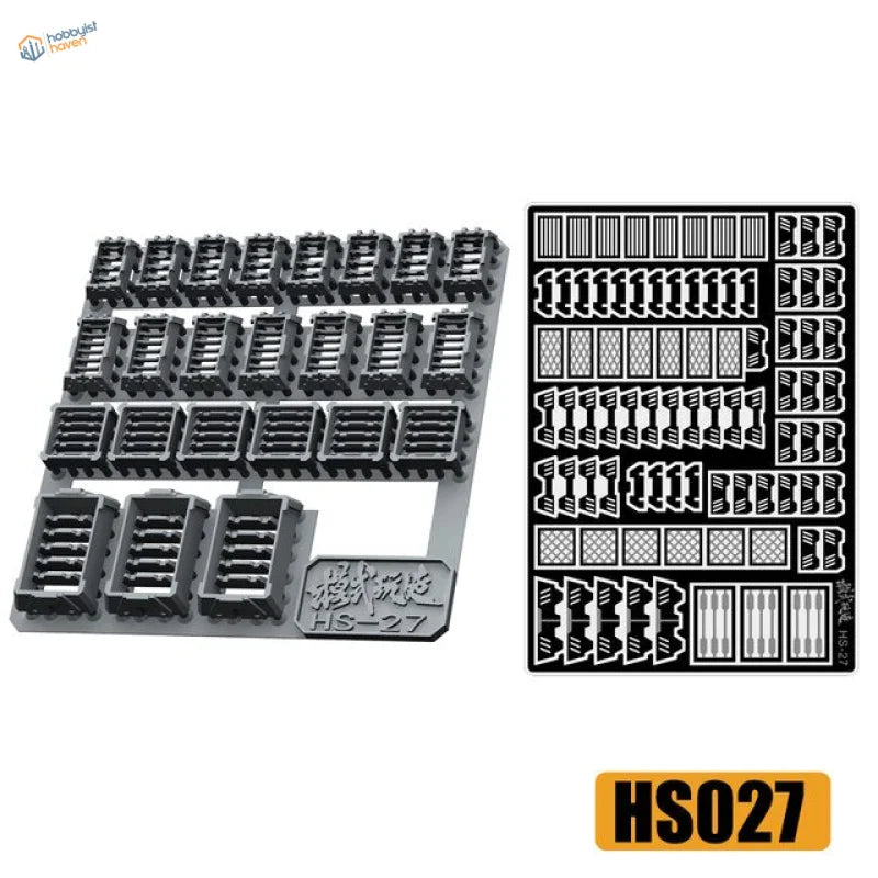 Black plastic detailing parts for Gunplas with decals on gray baseplate