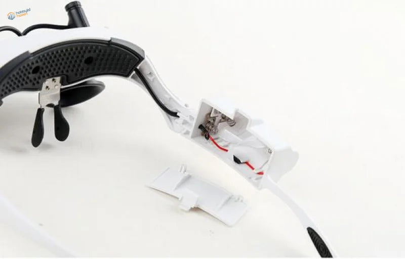 Double-eye magnifier, rear view showing the LED lamp battery housing