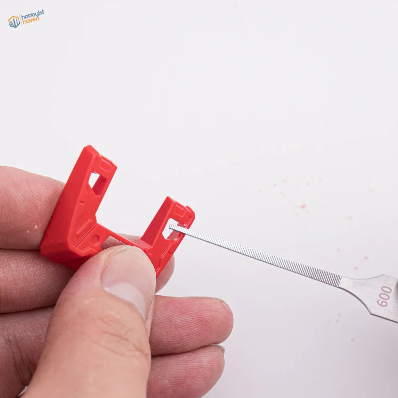 Red plastic bike lock shackle opened by stainless steel ultra-fine files