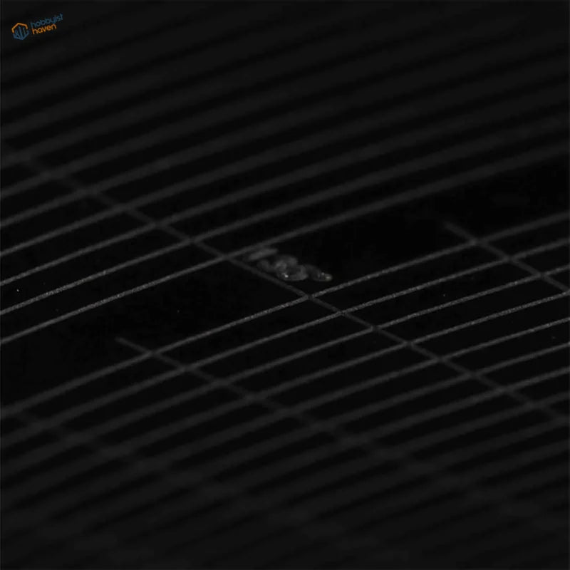 Translucent droplet on dark grid of DSPIAE masking tape cutting templates