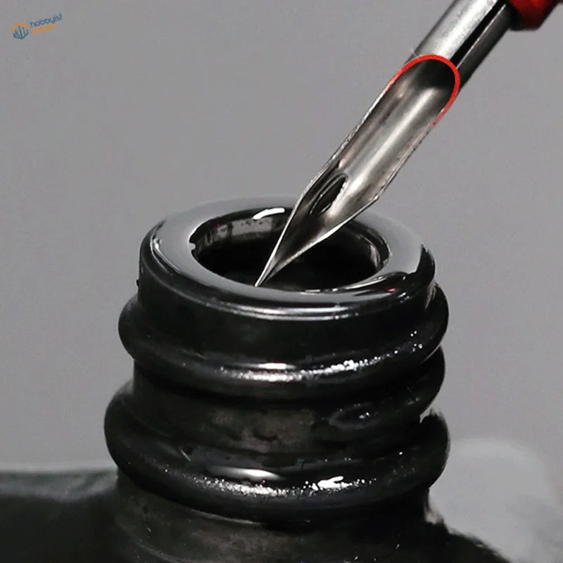 DSPIAE panel liner pen nib dipped in glossy black inkwell for panel lines