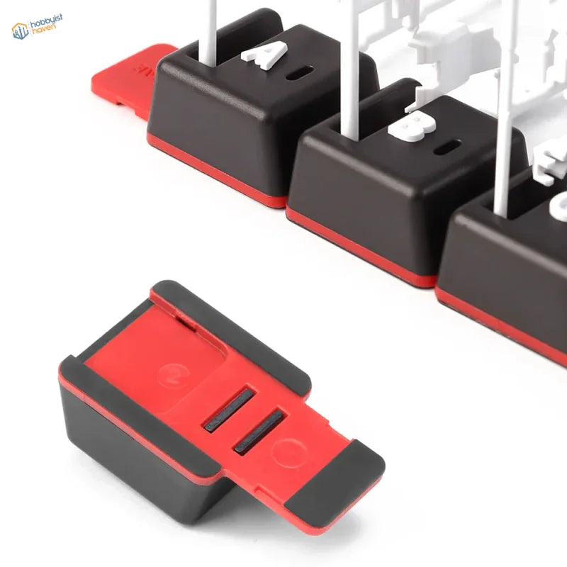 Dspiae sprue organizing tabs with red black keycaps white lettering