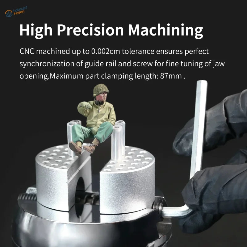 DSPIAE universal spherical vise with silver CNC jaws and miniature soldier figurine