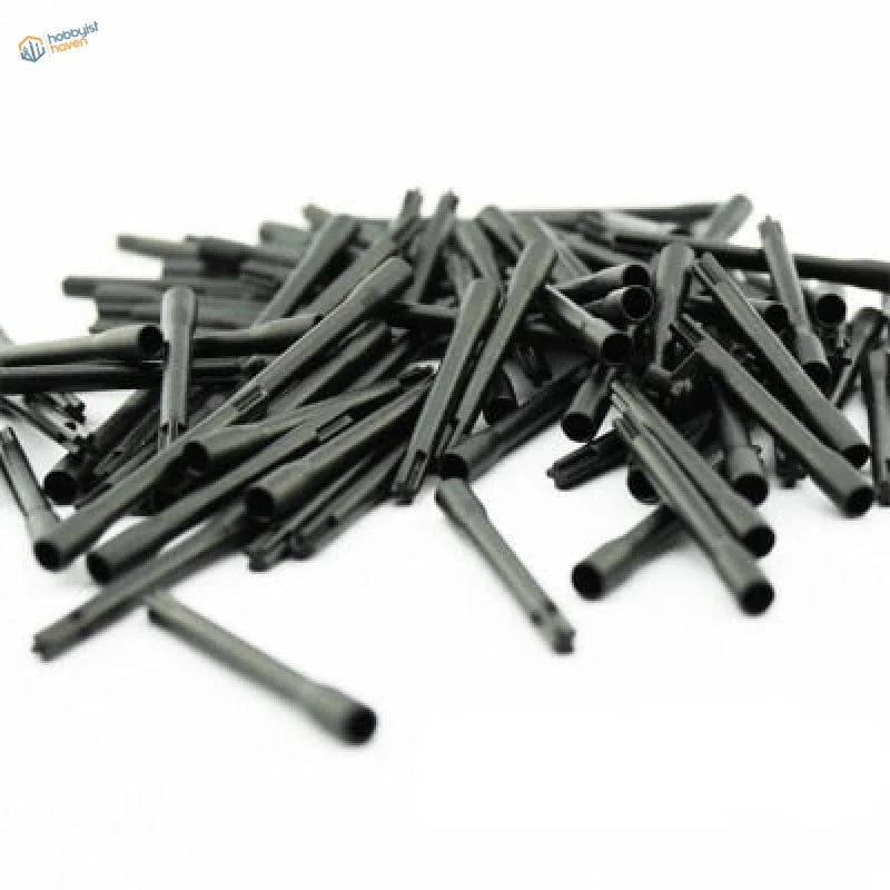 Black plastic pen caps piled for electric paint stirrer