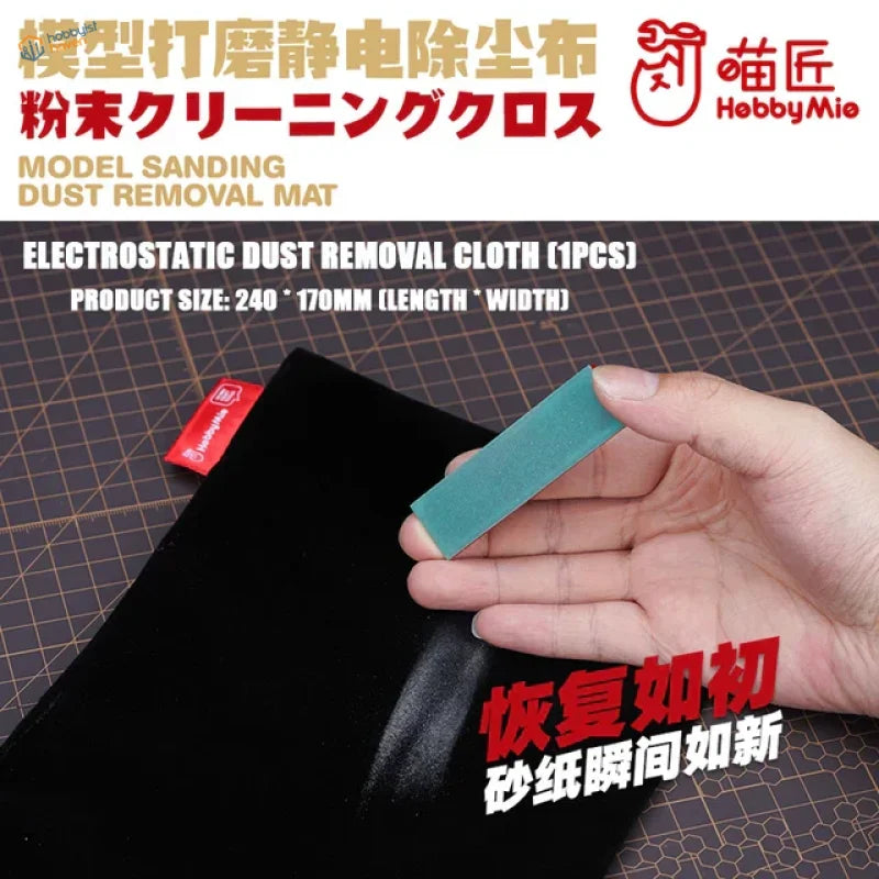 Hand holding teal hobbymie black electrostatic dust cloth on acrylic sanding sticks