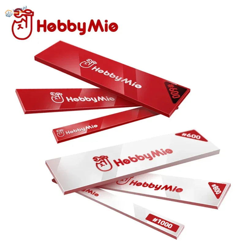 Red and white Hobbymie gift cards on acrylic sanding sticks