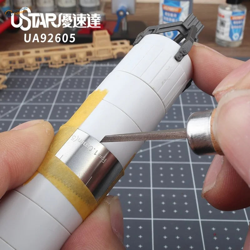 White plastic rocket with silver band for Flexible Equidistant Marking Engraving Guide, scale modeling tool
