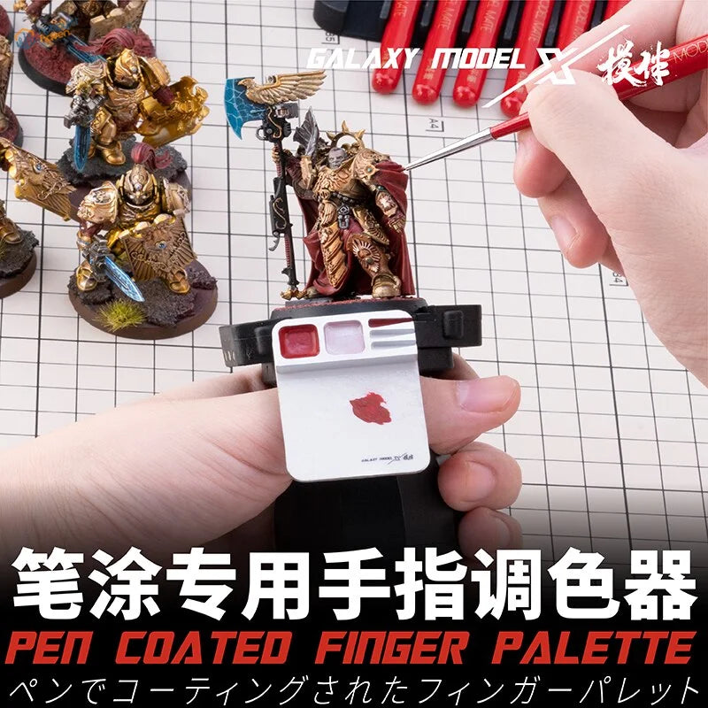 Galaxy Tools Finger Palette: black and white pen-coated with red paint on mini figure