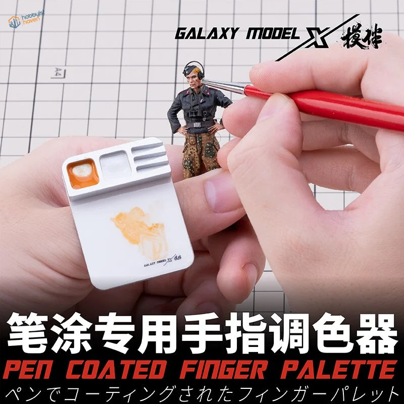 Galaxy Tools Finger Palette with white pen-coated surface, orange paint sample