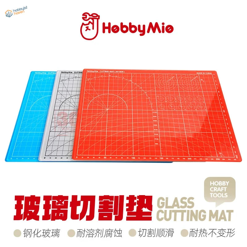Three Hobbymie glass cutting mats in blue, gray, red with grid lines