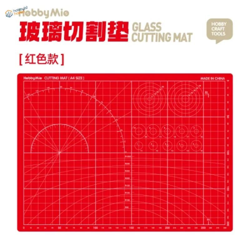 Red glass cutting mat with white grid lines and measurements