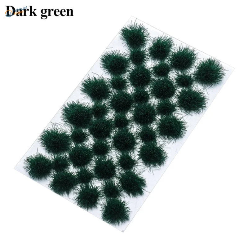 Dark green fuzzy grass flower patches on clear plastic sheet