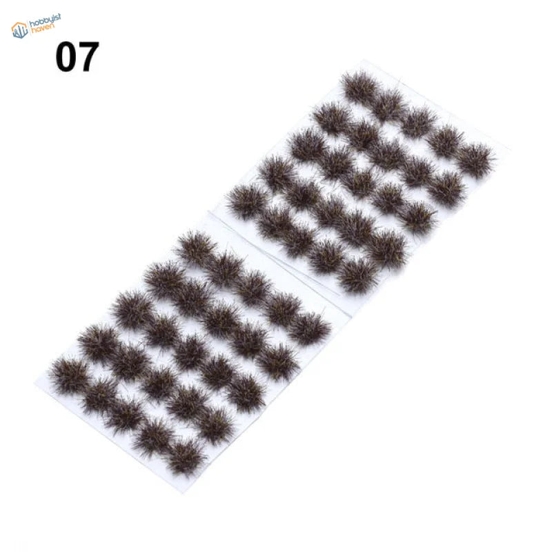 Dark brown fuzzy grass flower patches in neat rows on white backing