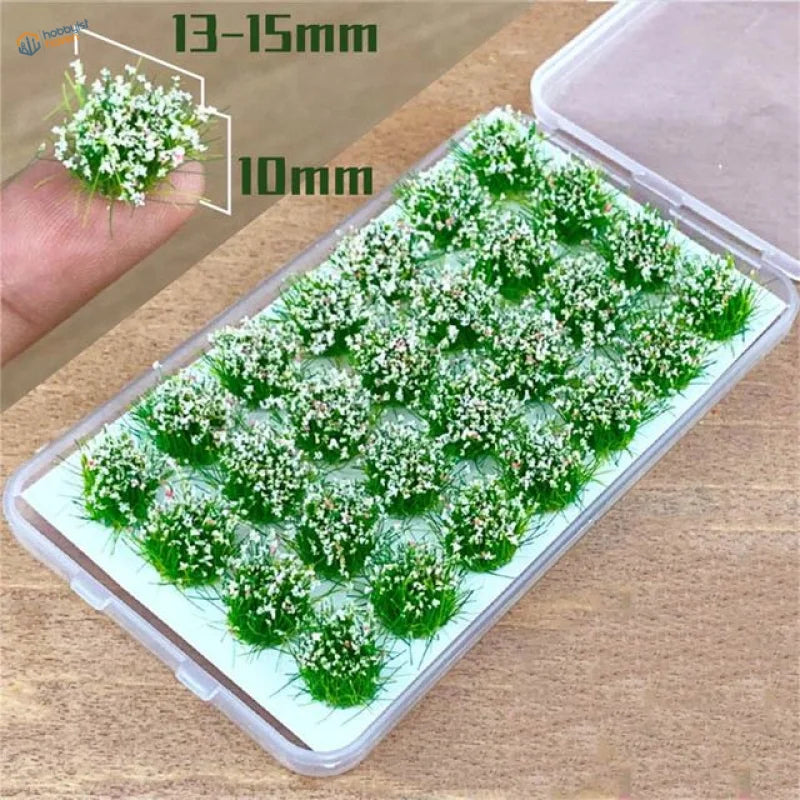 Green grass flower patches with tiny white flowers in clear container, 60 models