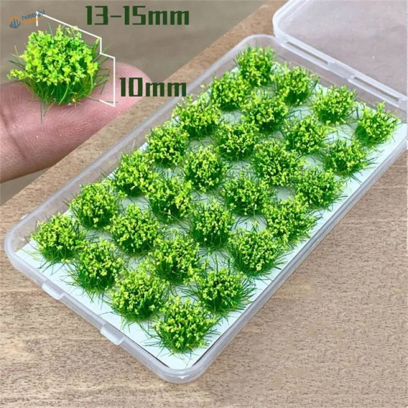 Bright green artificial grass flower patches in clear plastic container