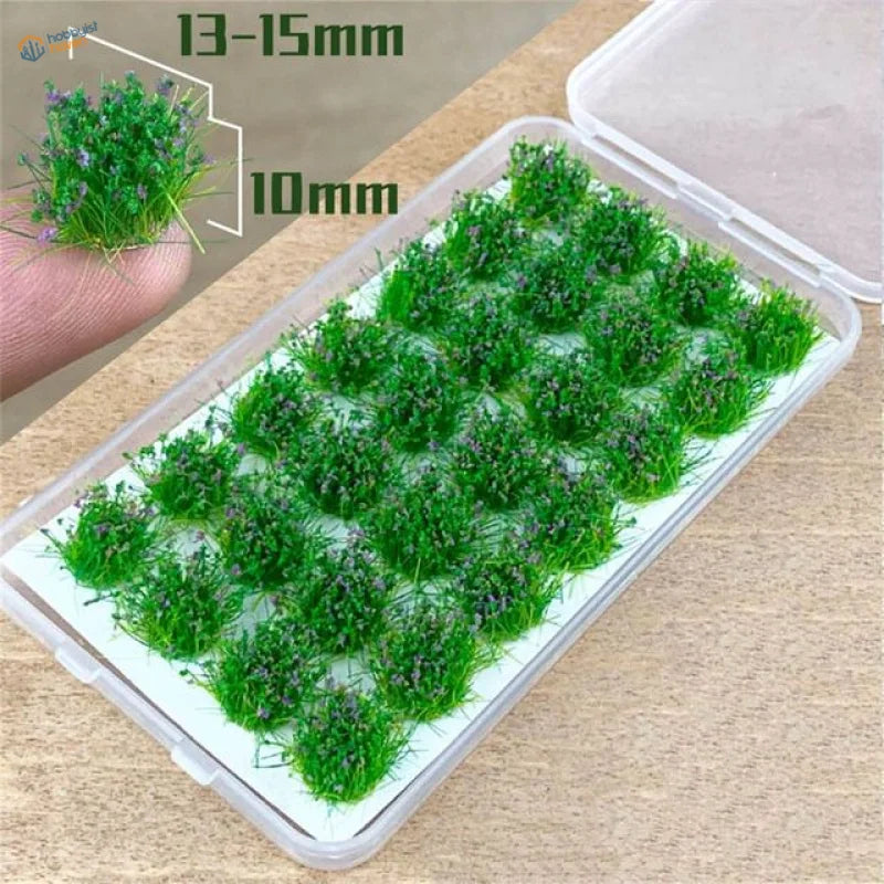 Green grass flower patches with purple flowers in clear container