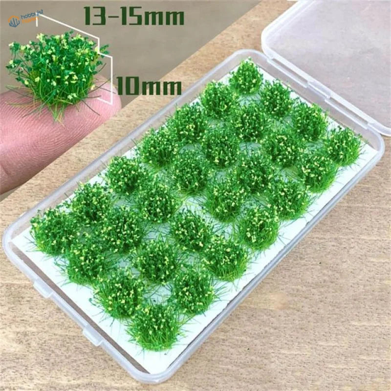 Green grass flower patches with yellow flowers in clear plastic container