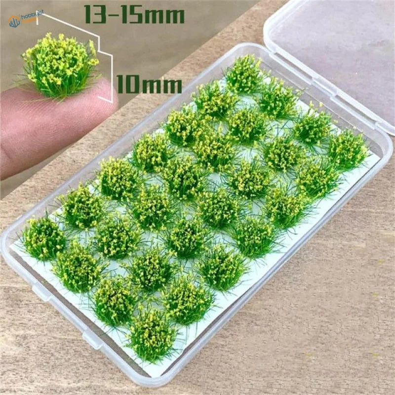Green artificial grass tufts and flower patches for miniature scenery modeling