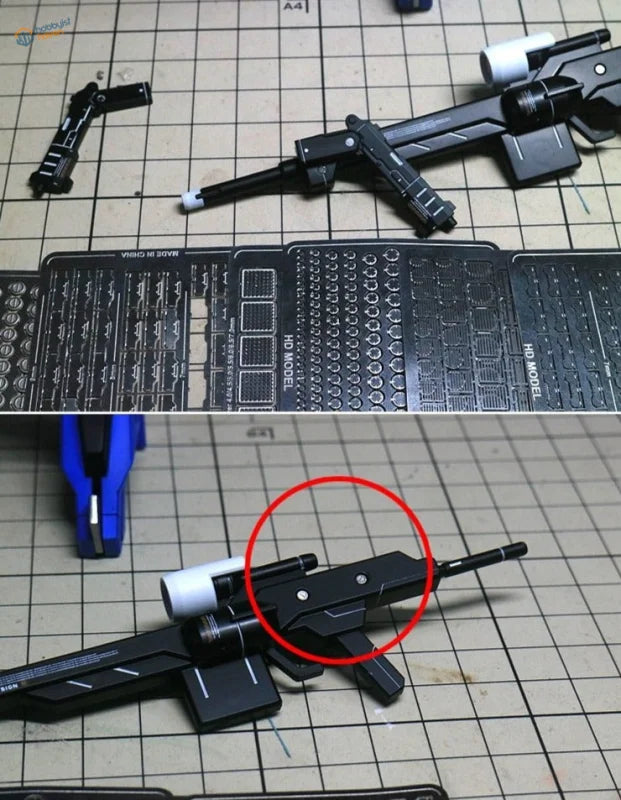 Black plastic Gundam model rifle with metal etch plates attachment