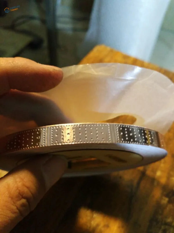 Silver metallic bracelet with dotted pattern on HARVEY 18470 battleship copper hull