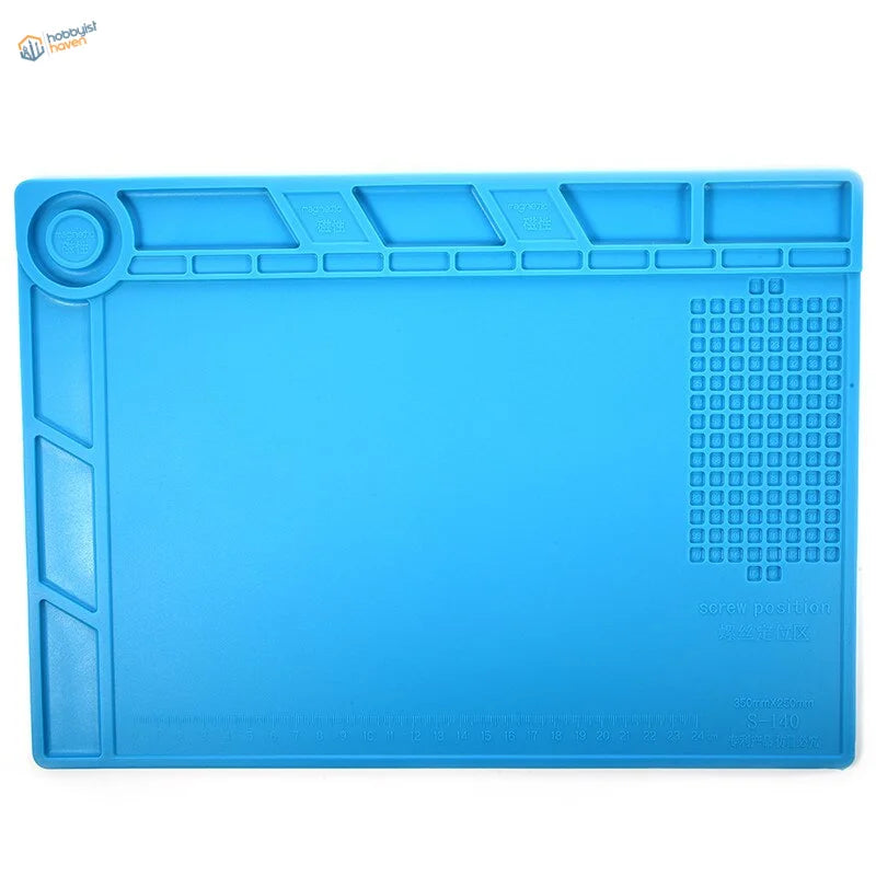Blue silicone desk mat for soldering iron with molded compartments