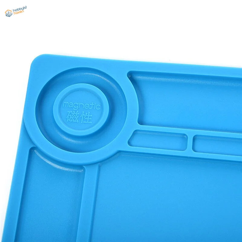 Blue silicone desk mat with magnetic sections for soldering iron